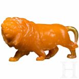 A small carved probably Italian amber sculpture of a lion, 19th century Fine and detailedly carved