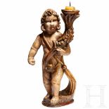 A carved southern German Angel with candelabra, circa 1700Vollplastische, aus Weichholz