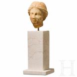 A small Hellenistic marble head, 3rd – 2nd century B.C.Small marble head of a woman with fine