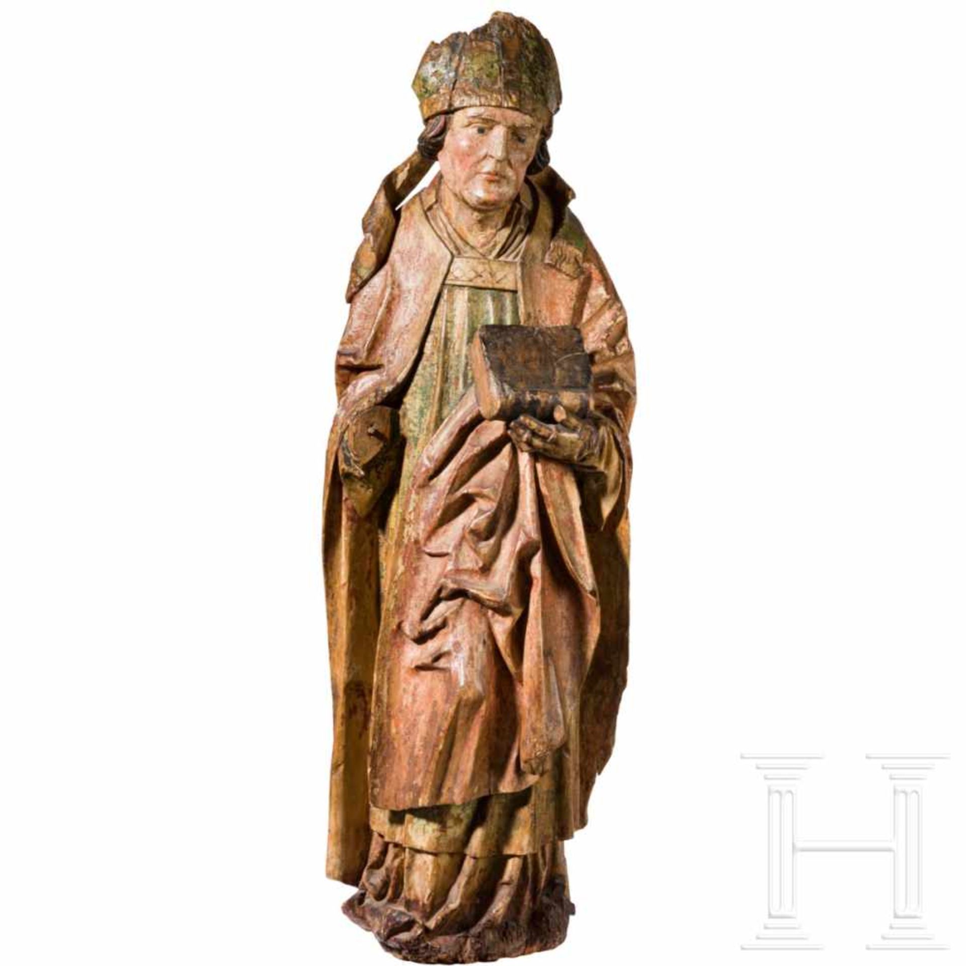 A South German sculpture of a church father, circa 1500The lime wood figure painted in colour and