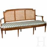 A fine French carved Louis XVI walnut settee, circa 1790Carved walnut. Intact meshwork. Separate