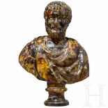 An amber bust of a Roman emporerSmall bust of a bearded Roman emperor on a round base. The emperor