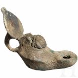 A small Roman bronze oil lamp, 1st - 2nd century A.D.With eyelet handle, a leaf on top. Hinged lid