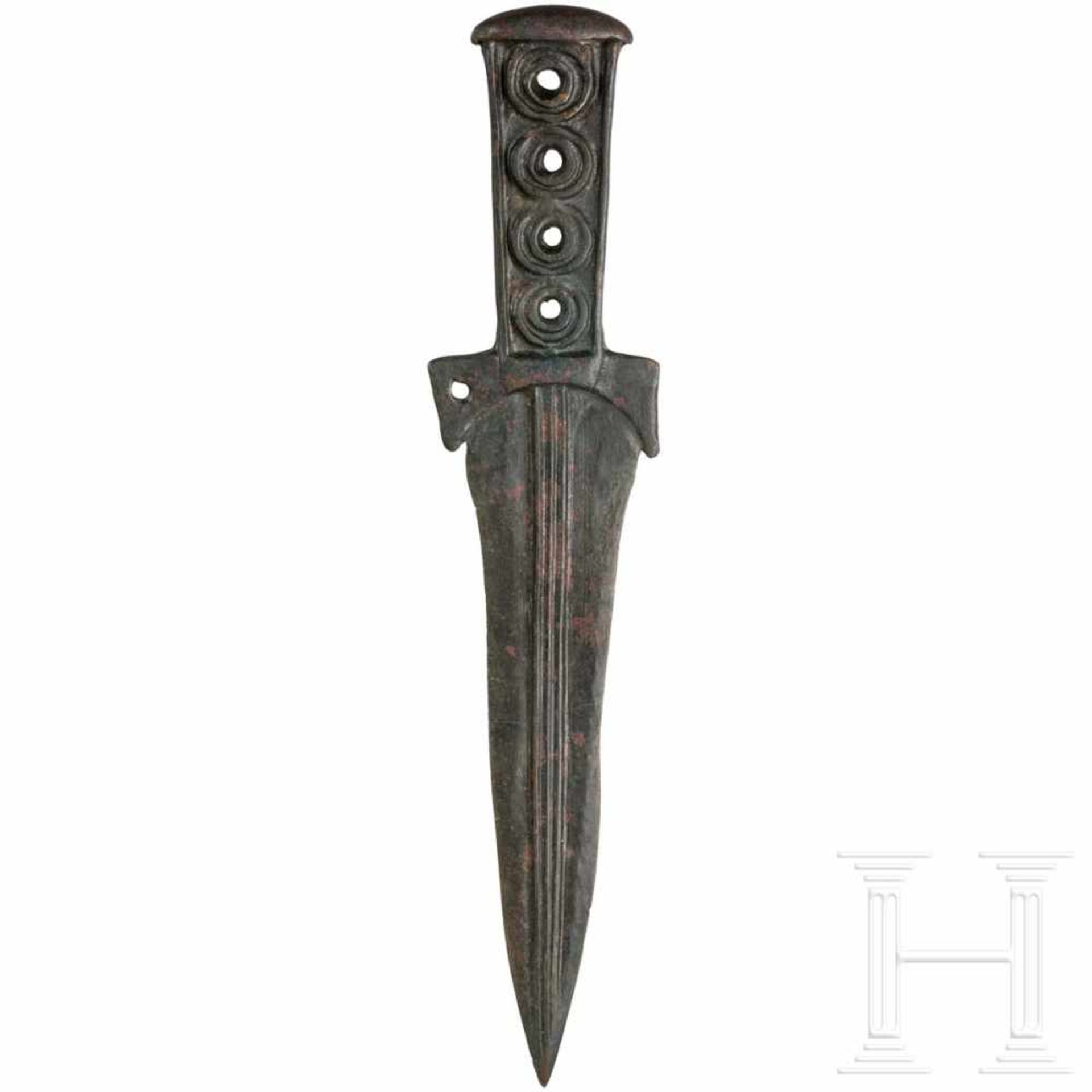 A Cimmerian bronze dagger, 7th century B.C.Bronze dagger finely cast in one piece with a tapering