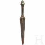 A Luristan bronze dagger, late 2nd millenium B.C.Blade with rounded tip and middle ridge. Few