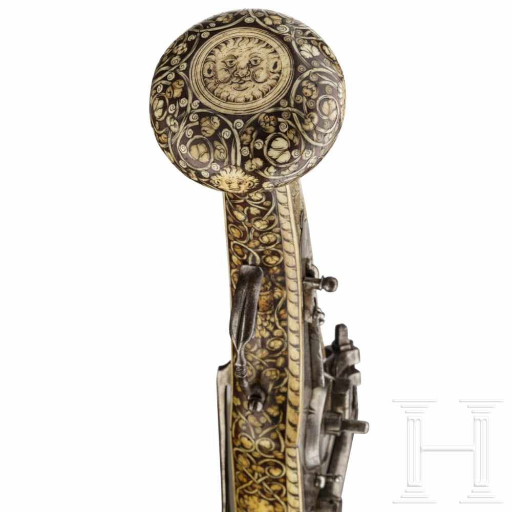 A German wheellock puffer, lavishly inlaid in bone, dated 1573The smooth octagonal barrel turning to - Image 9 of 10