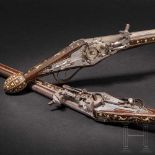 A pair of bone-inlaid, extremely long wheellock pistols, Nuremberg, circa 1600The long, round,