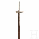 A German late Gothic war hammer, circa 1500The slender spike of diamond section, the ridges