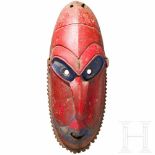 A Papua New Guinean dancemask from the Murik lakesLängliche, polychrom gefasste Holzmaske in Form