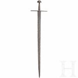 A German knightly sword, circa 1100 - 50Double-edged blade with flat fullers on both sides extending