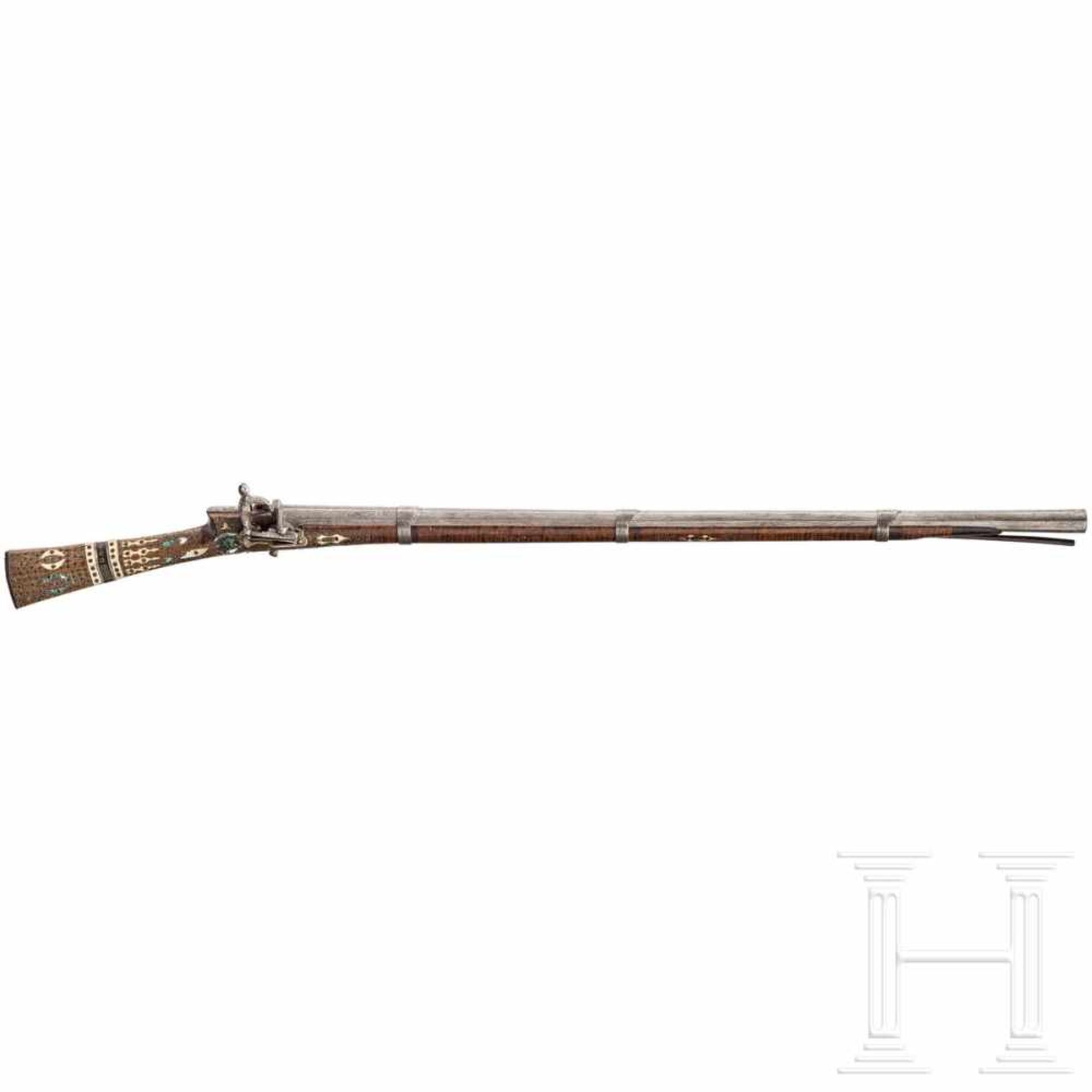 A small Ottoman miquelet-lock rifle (tufek), 18th centuryOctagonal swamped barrel of Damascus