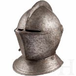 A North German/Flemish close helmet, circa 1580One-piece hammered skull rising to a roped comb. On