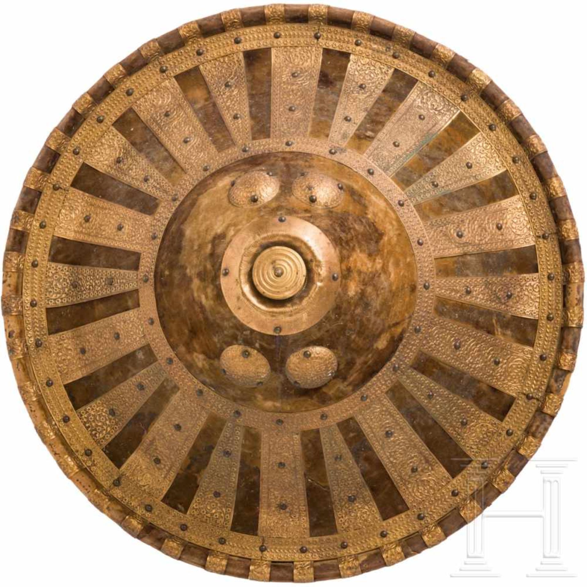 A shield of Amhara with gilded bronze fittings, Ethiopia, 1st half of the 20th centuryStark