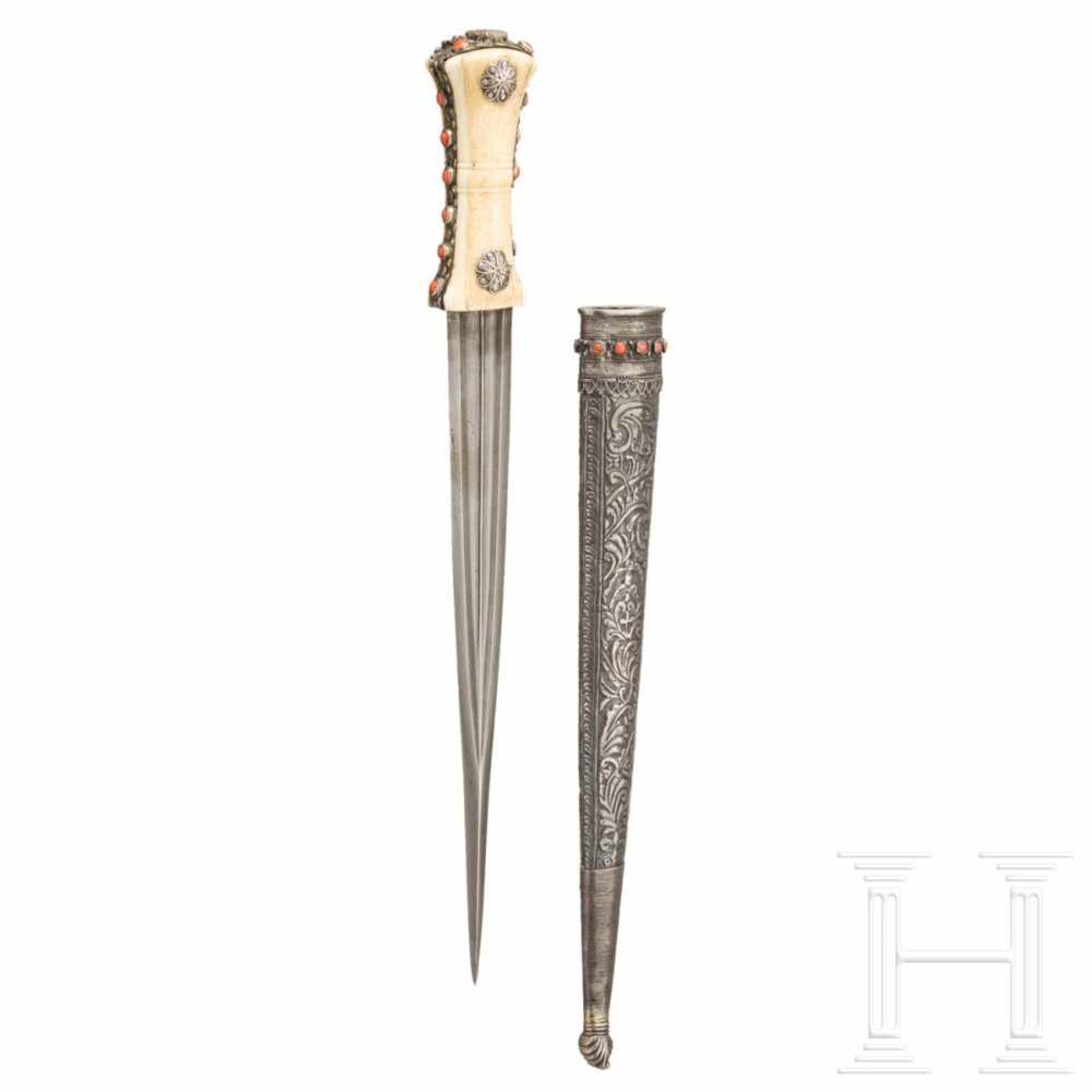 An Ottoman silver-mounted spearhead dagger, set with corals, circa 1800The double-edged blade in