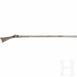A Tunisian silver-mounted miquelet rifle, dated 1824Narrow, octagonal barrel with smooth bore in
