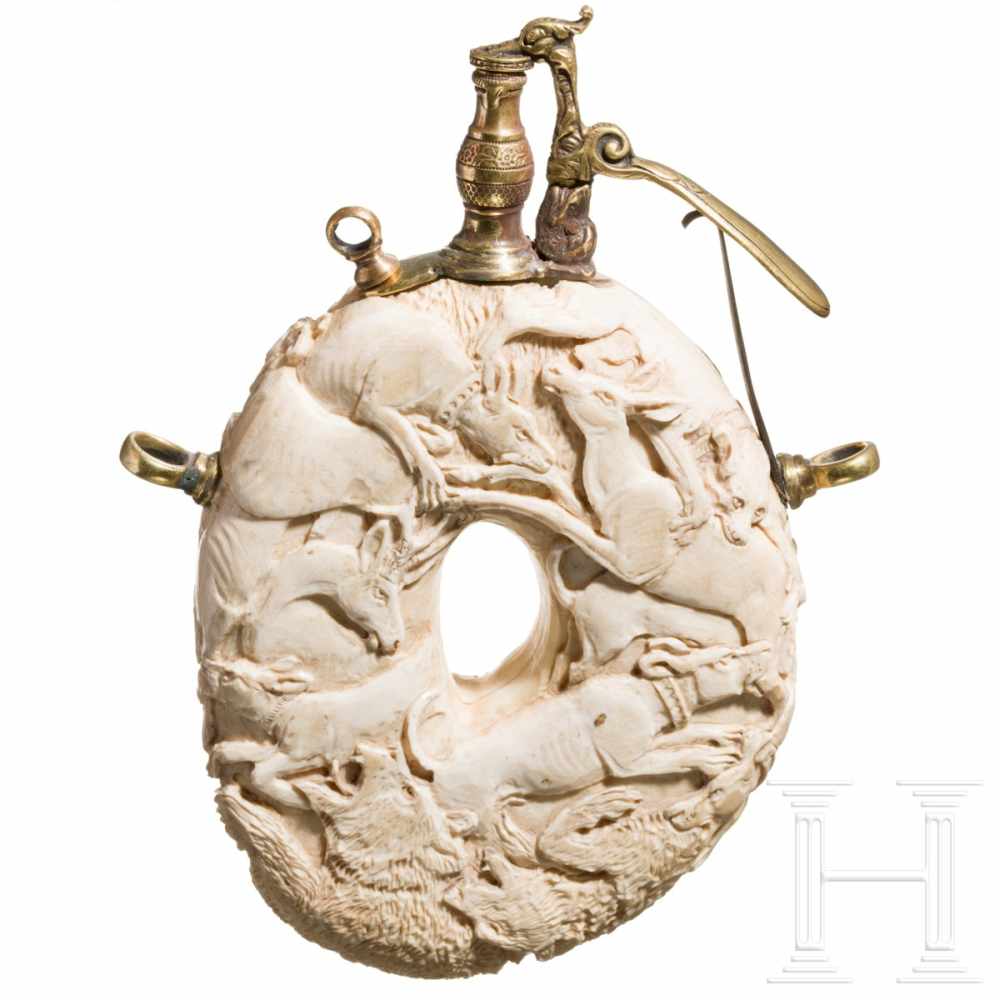 A carved German hunting powder flask (ivory) in the style of the Maucher workshop, 19th