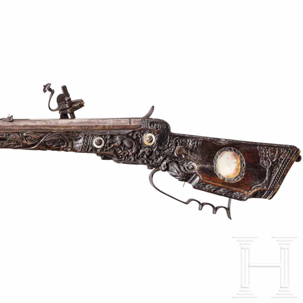 A southern German carved wheellock rifle with mother-of-pearl inlays in the style of the Maucher - Image 8 of 8