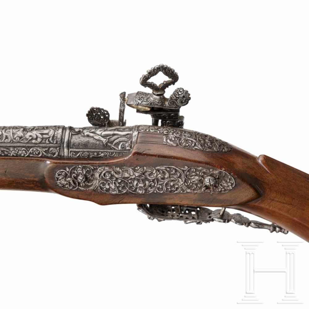 A luxurious Italian miquelet-rifle with chiselled decoration, Brescia, circa 1680Round barrel with - Image 3 of 11