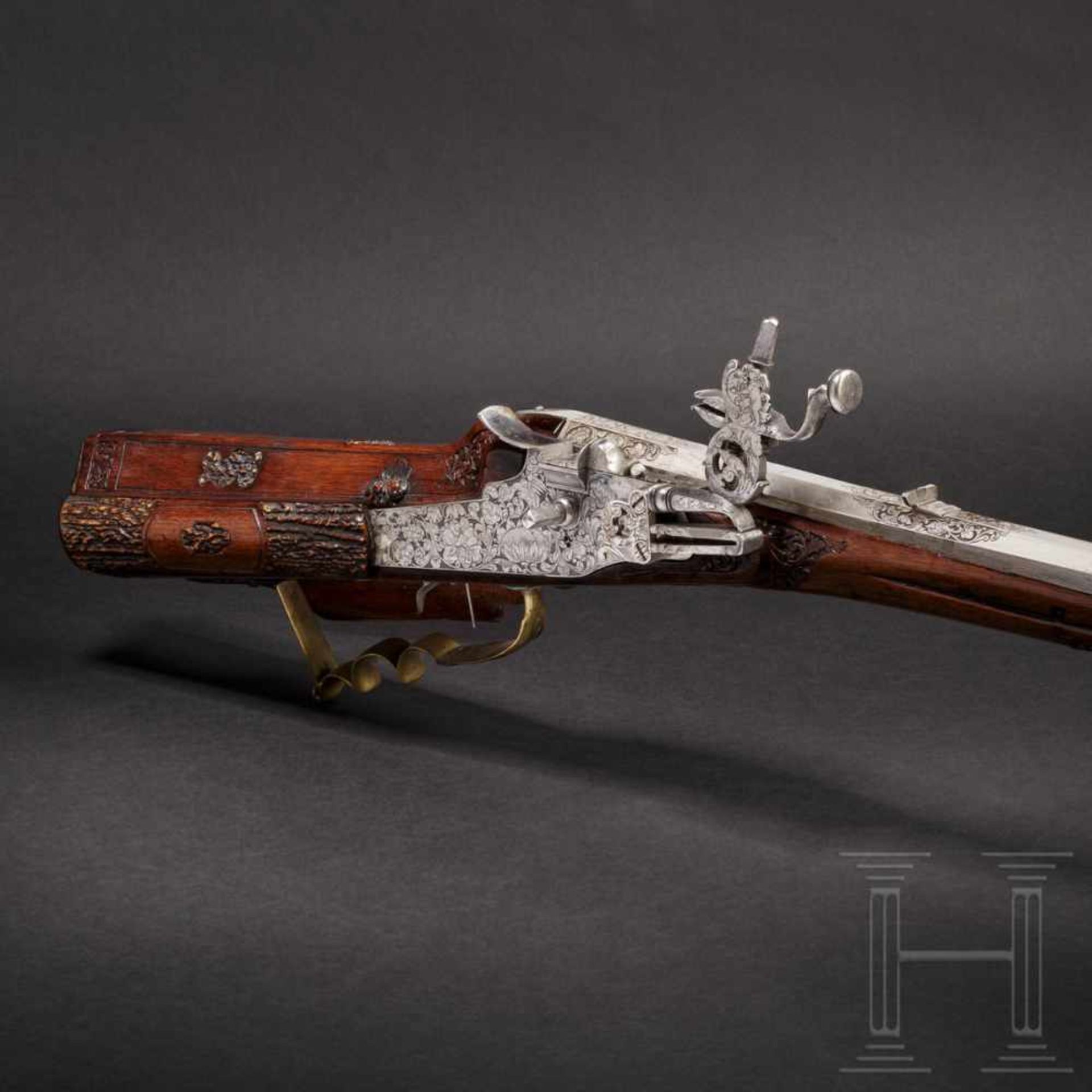 A German hunting wheellock rifle, the stock inlaid with staghorn, circa 1700The octagonal barrel