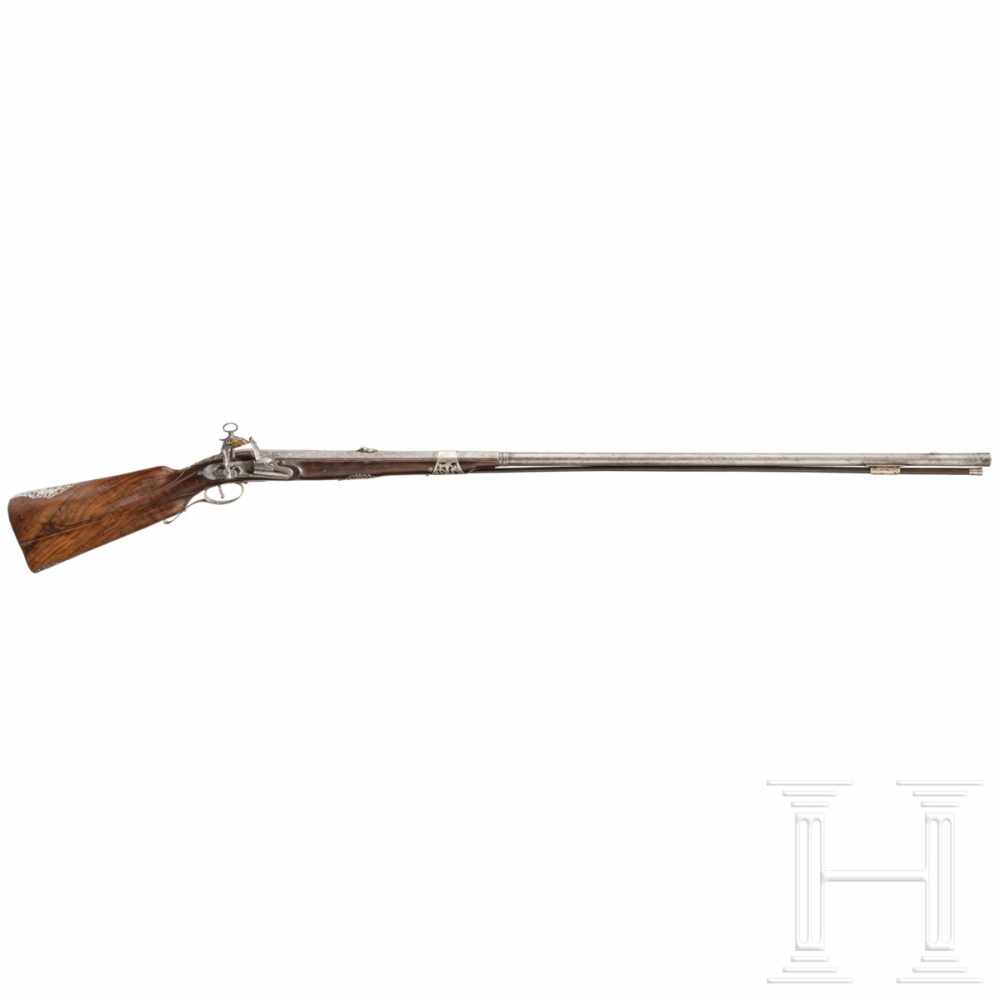 An Italian silver-mounted deluxe miquelet rifle, circa 1710/20Two-stage smooth-bore barrel,