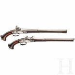 A pair of long flintlock pistols, Brescia, circa 1660Octagonal, smooth barrels turning to finely