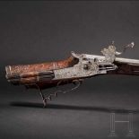 A fine wheellock rifle with chiseled lock, Augsburg, circa 1700Octagonal, lightly tapered barrel