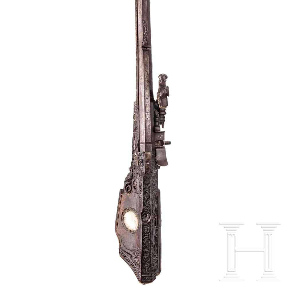 A southern German carved wheellock rifle with mother-of-pearl inlays in the style of the Maucher - Image 4 of 8