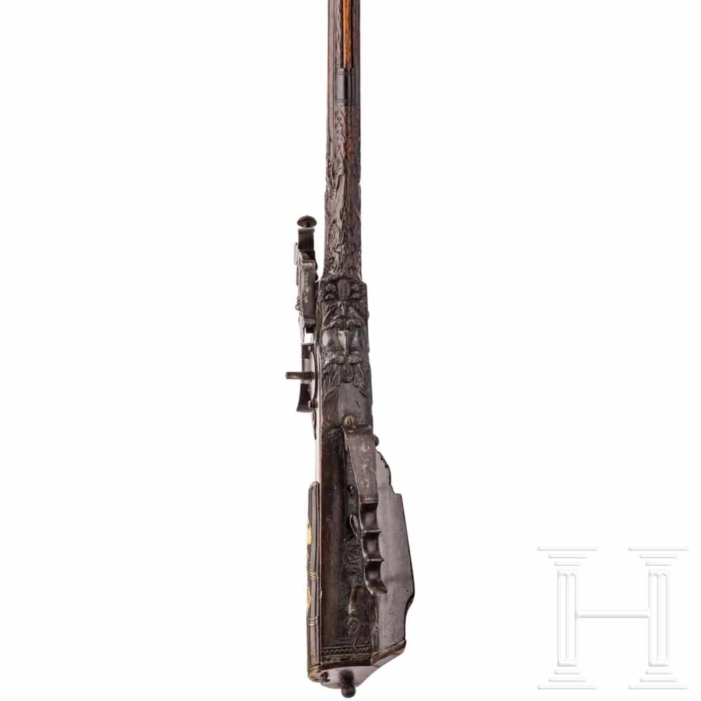 A southern German carved wheellock rifle with mother-of-pearl inlays in the style of the Maucher - Image 5 of 8