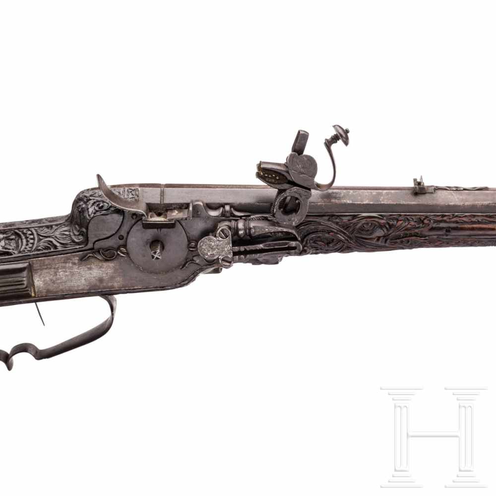 A southern German carved wheellock rifle with mother-of-pearl inlays in the style of the Maucher - Image 3 of 8