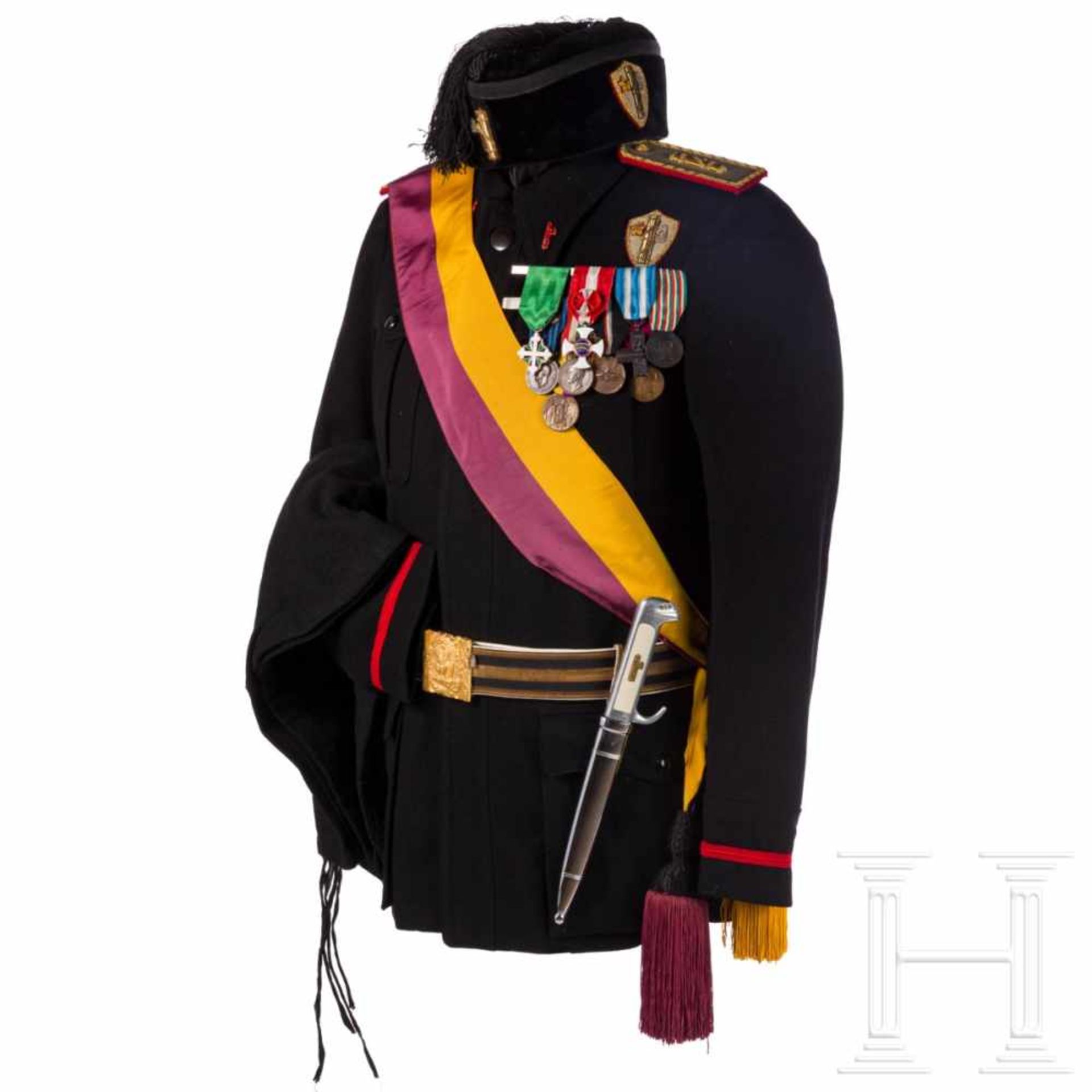 A black PNF uniform with dagger, order and documents, before 1945Black velvet fez with gold-
