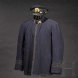 A set comprising uniform and equipment belonging to a World War II naval officerA visor cap in