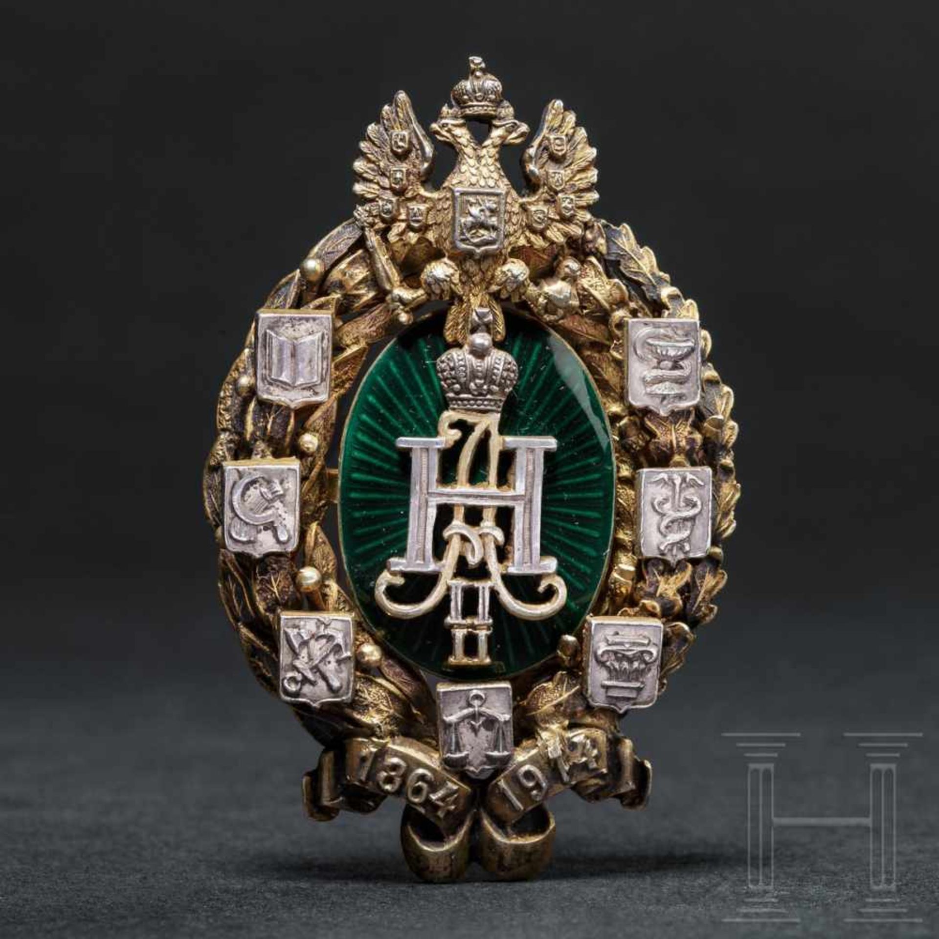 A jubilee bagde for the fiftieth anniversary of Zemstvo, circa 1910Gilt silver, enamelled in dark