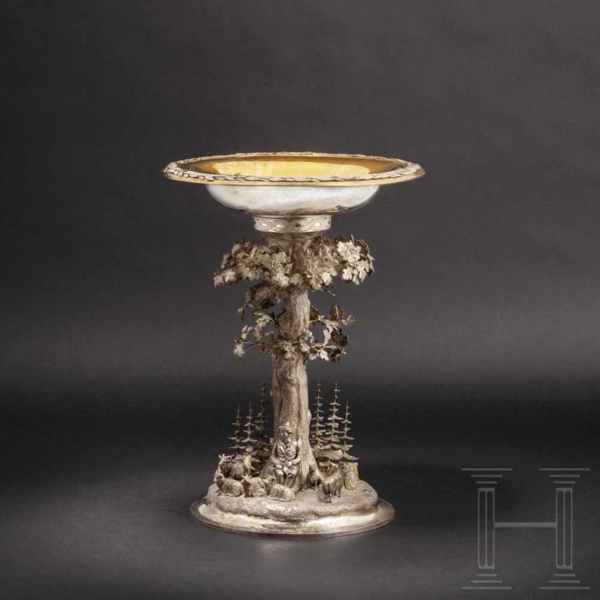 A large table centrepiece for King George V of Hanover, dated 1868Silver, the bowl partly gilt, on