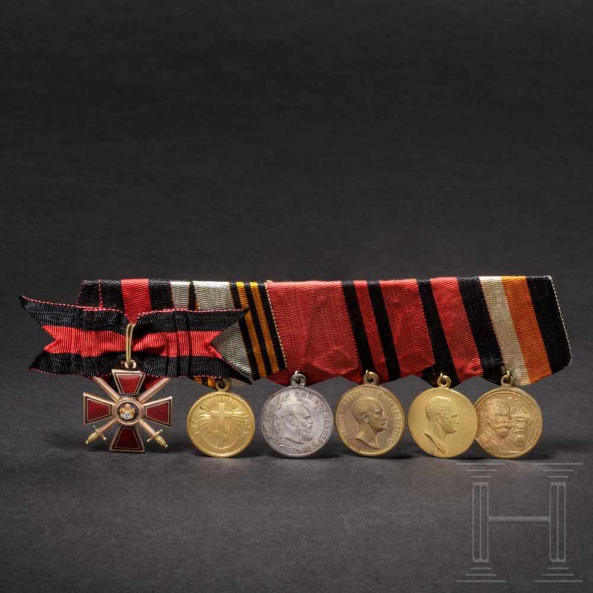 A Russian medal bar of orders with a Cross of the Order of St. Vladimir, 4th Class with Swords, five