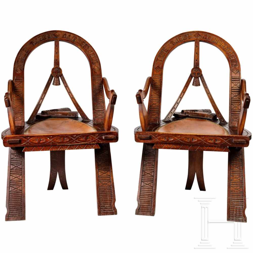 Two carved Russian armchairs in Russian style "Bow, Axes and Mittens", after the well-known model of