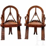 Two carved Russian armchairs in Russian style "Bow, Axes and Mittens", after the well-known model of