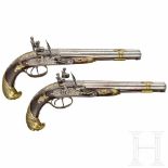 A pair of double-barrelled flintlock pistols, circa 1780Both pistols with single, smooth barrels