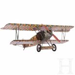 A detailed model of a Fokker D VIIBody and wings covered with cloth, camouflage painting and