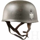 An M 38 steel helmet for army paratroopers, with one badgeThe skull with the original field-grey