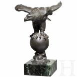 A bronze eagle on a globe by Schüler, BerlinMassive Bronze, patiniert, an der Plinthe die