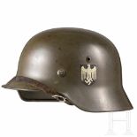 An army steel helmet M 35 with double decal and acceptance stamp of the procurement officeGlocke mit