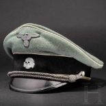 A visor cap for officers of the Waffen SSSaddle-shaped, in fine, field-grey woollen cloth with white