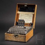 An "Enigma I" cipher machine, number "A 10694", complete with the wooden caseThree encryption rotors