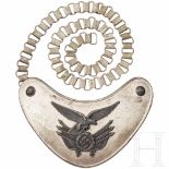 An M36 gorget for Luftwaffe flag bearersThe crescent-shaped, silver-plated shield with patinated old