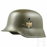 An M 35 parade helmet for the Army with both badgesThe deluxe issue in vulcanised fibre made by Erel