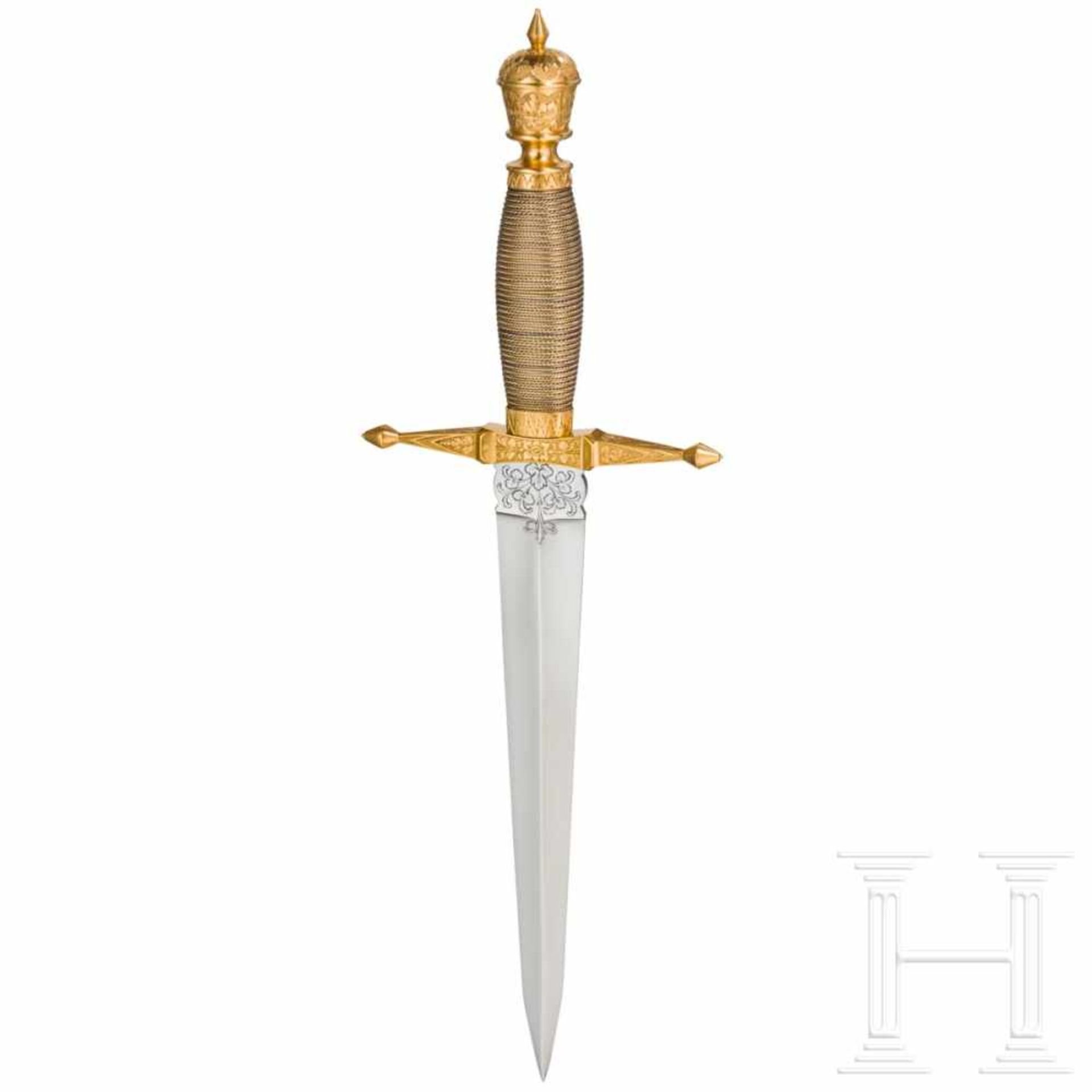 A gold presentation dagger of the GDRThe double-edged thrusting blade with chiselled foliage at