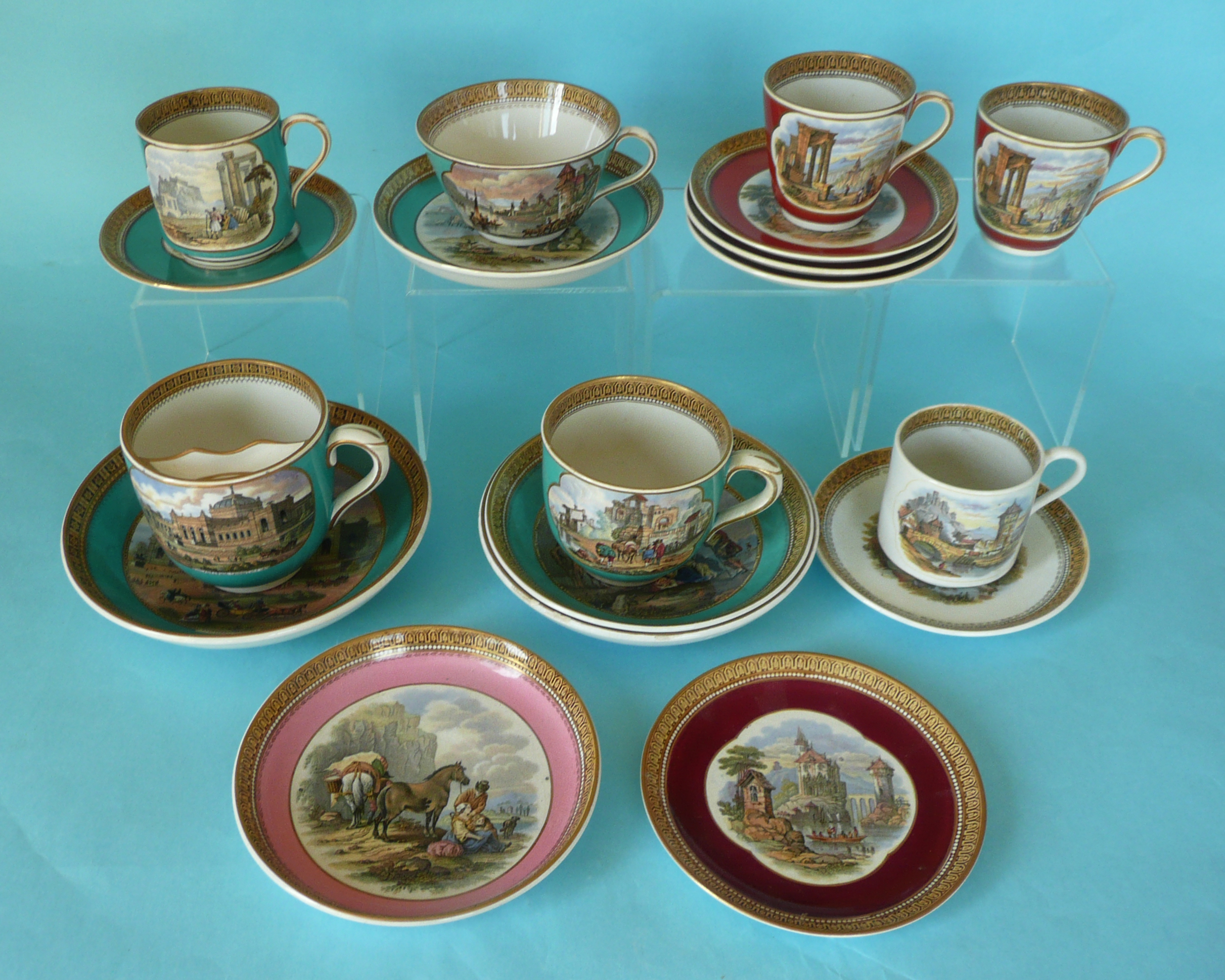 A moustache cup and saucer, three cups and four saucers all green, two red cups