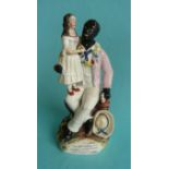 A Staffordshire pottery figure depicting a seated Uncle Tom with Eva standing upon his knee