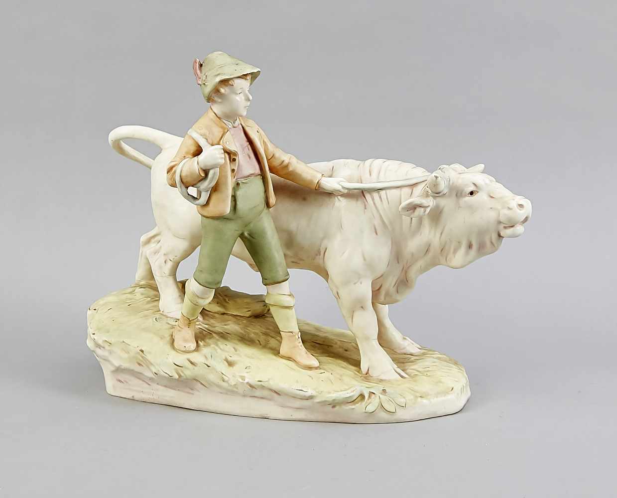 Boy with ox, Royal Dux, Bohemia, 20th century, painted in subtle pastel colors, slightly