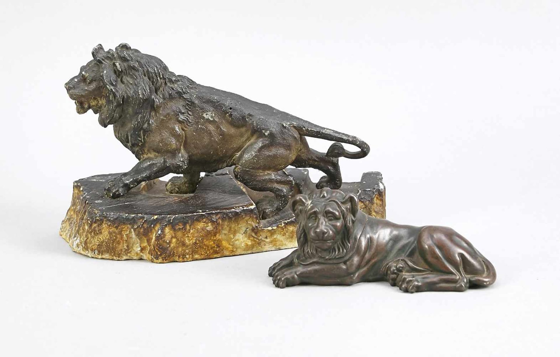 Two lions, small sculptures by various artists around 1900, a walking lion made of dark